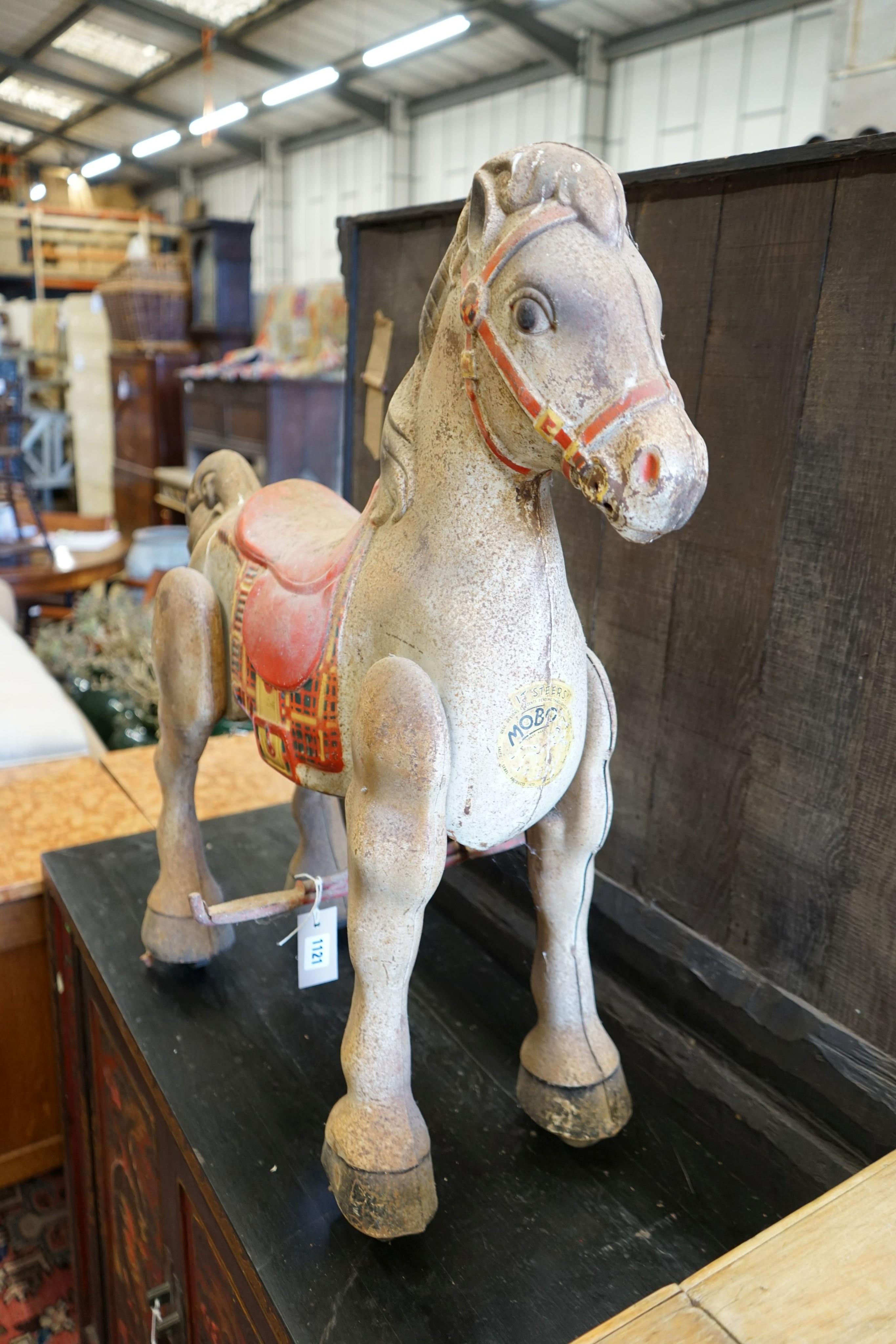 A vintage Mobo painted tinplate toy sit on horse, length 66cm